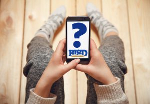 Person holding phone with question mark and BISD logo